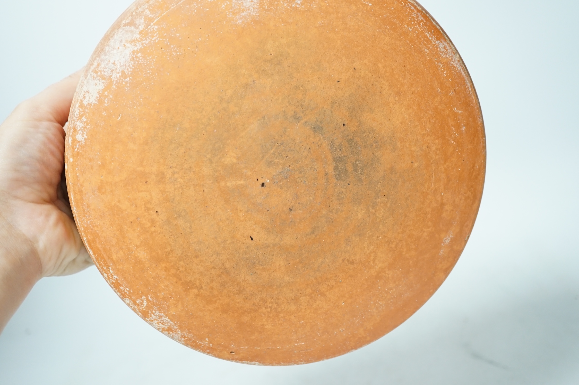 A Roman terra sigillata circular pottery bowl, c.1-300AD, top rim 20cm diameter. Condition - good for age, wear to edge of top rim as to be expected